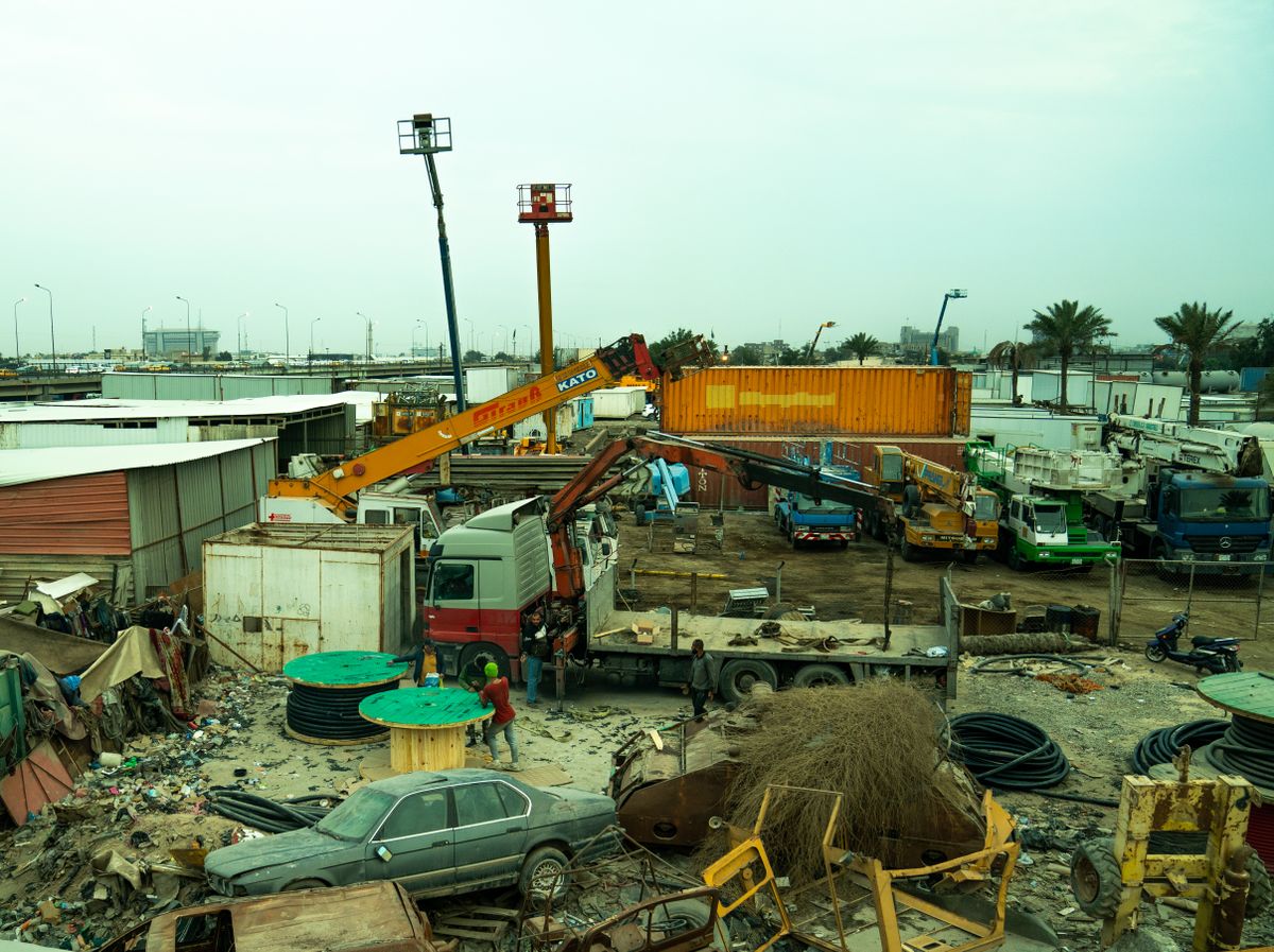 Illustrative view of vehicles and equipment in a materials yard
