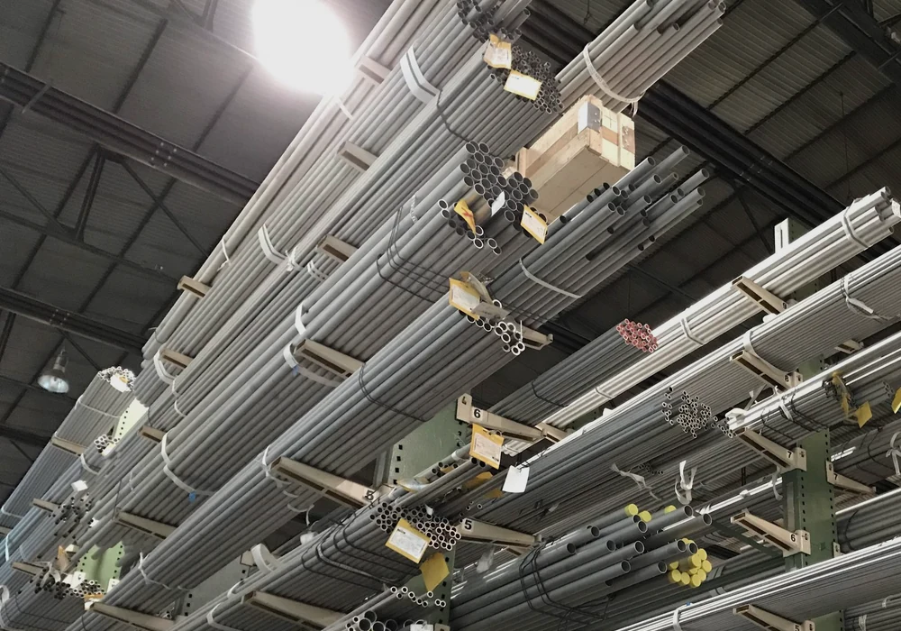 Bundles of steel tubes stored on warehouse racks