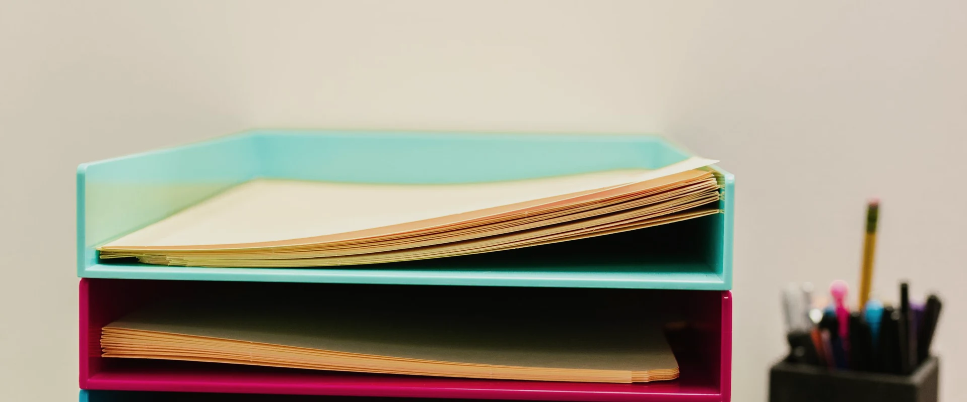 Unlabeled paper folders organized in stacked document trays
