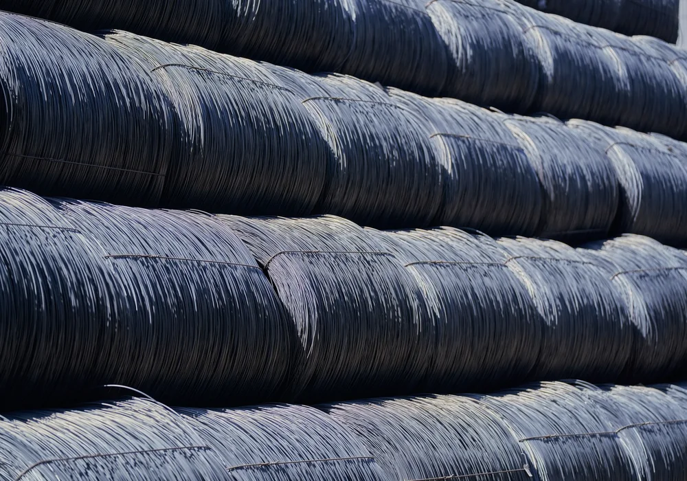 Steel wire coils stacked together outdoors